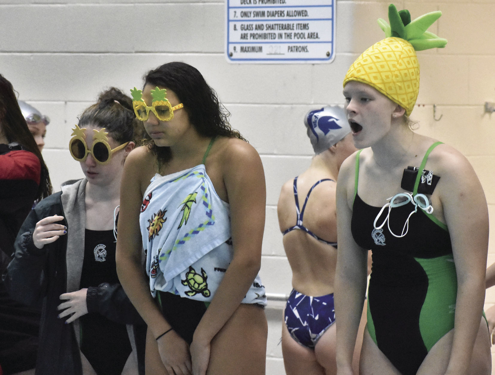 Prep girls swimming photo: Madison Memorial swimmers get in the spirit for the Pineapple Relay